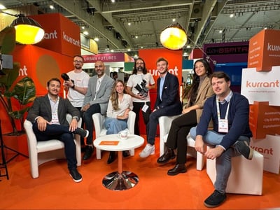 The Kurrant Team posing for a photo at their booth at the smart city expo in Barcelona
