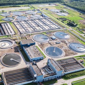 A smart utility water treatment plant seen from above, efficiently managing water resources.