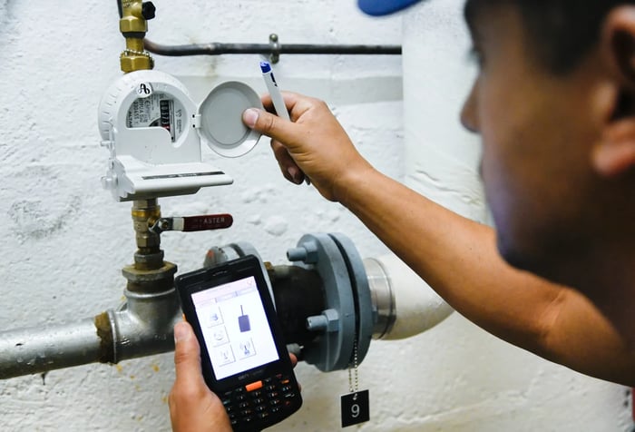 An engineer inspecting a Smart Water Meter