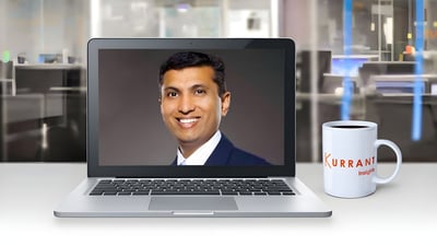 Rasesh Patel on a laptop screen next to a Kurrant Insights coffee mug in a blurred office setting.