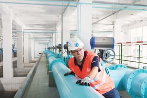 Engineer inspecting water pipes