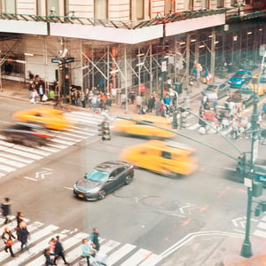 A bustling smart city street with blurred lights and movement, depicting the vibrant energy of urban life.