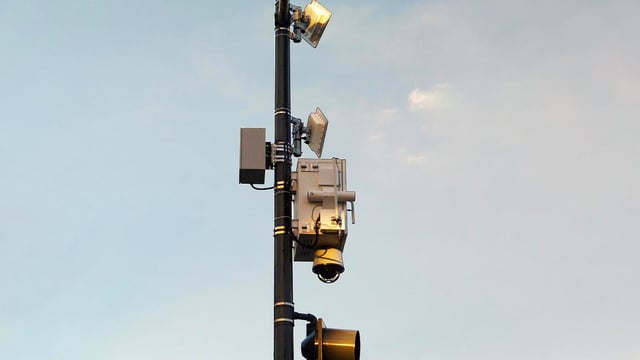 Connected Shot Detection Device mounted on a pole in a smart city.