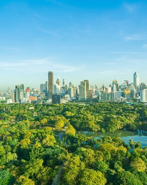 Bird's-eye view of a green smart city skyline.