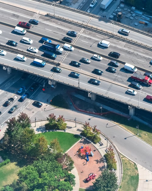 A busy highway, showcasing cars and trucks in motion, representing a smart mobility solution