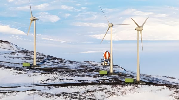 Three wind turbines and a red-and-white striped radome on a snow-covered mountain ridge under a blue sky.