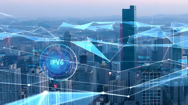 Digital cityscape with blue geometric network overlays and a circular icon containing the text IPV6.