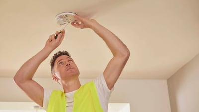 Engineer installing an indoor smart solution to prevent mold