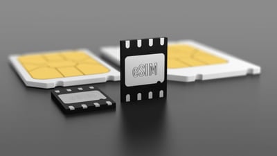 Photo of an e-sim surrounded by traditional sim cards