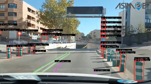 Dashcam view of an ASIMOB AI road inspection system detecting traffic signs, bollards, and lane markings on a city street