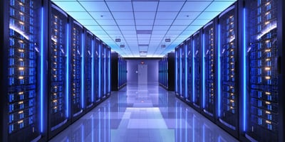 Photo of a server room with purple lighting