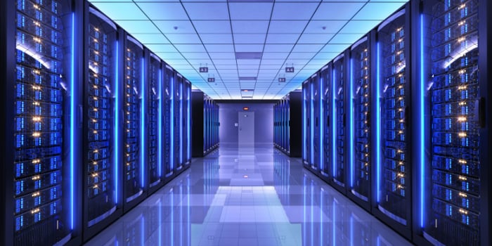 Photo of a server room with purple lighting