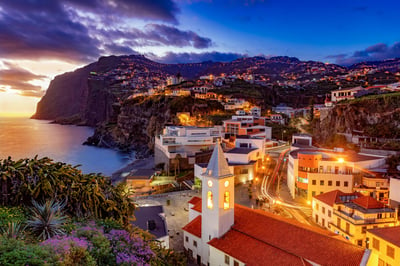 Madeira at sunset with illumintated smart street lights.