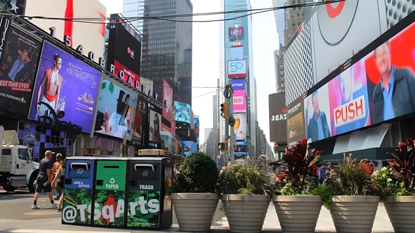 Bigbelly smart waste and recycling compactors on a Times Square sidewalk in New York City.