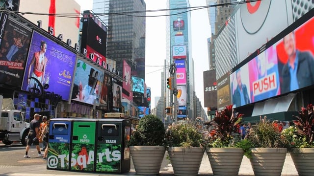 A photo of a street in New York City equipped with Bigbelly smart waste compactor