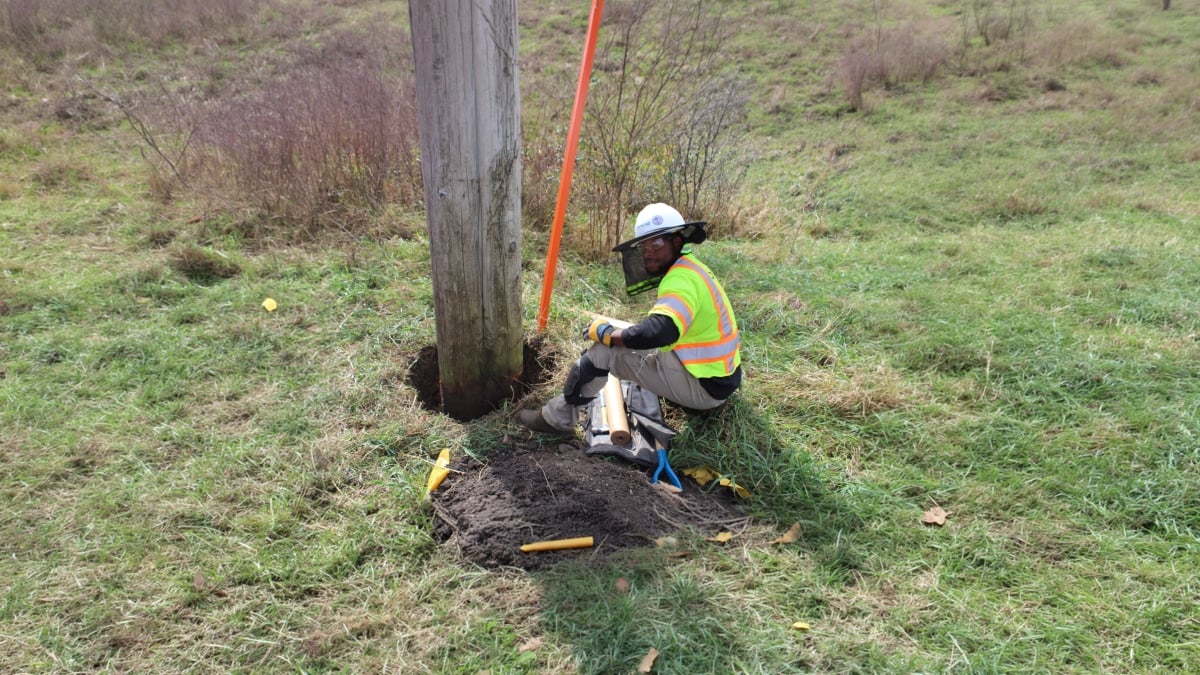 Utility engineer working on a pole
