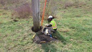 Utility engineer working on a pole