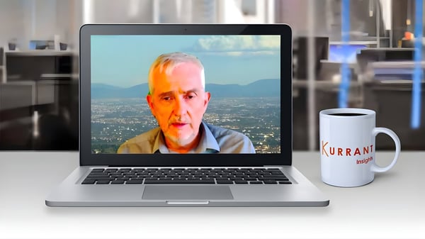 Paolo Nesi on a laptop video call next to a Kurrant Insights branded coffee mug in an office setting.