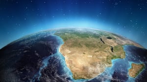 Satellite view of the southern African continent on Earth from space with a blue atmosphere and starry background
