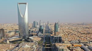 Aerial view of the Riyadh skyline in Saudi Arabia featuring the Kingdom Centre tower and King Fahd Road