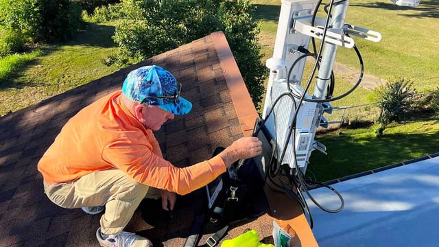 A man setting up a DeWi network to provide the city with connectivity