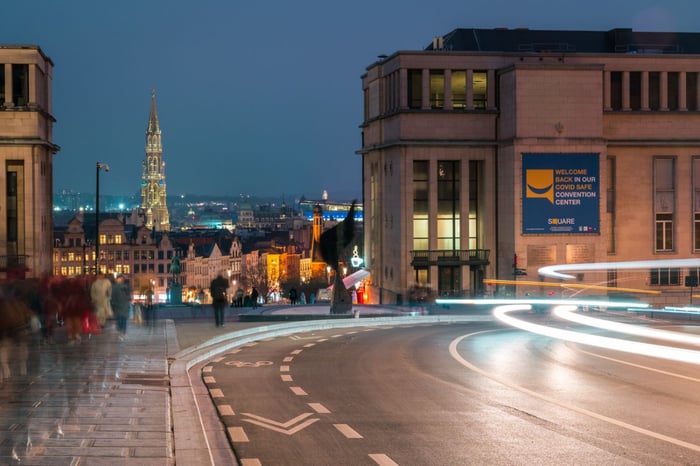 Long exposure photo of traffic on city street with smart street lighting.