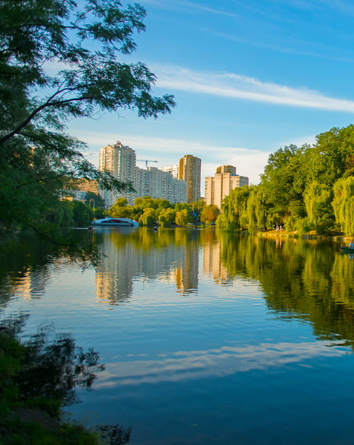 A picturesque body of water, harmoniously integrated into the urban landscape of a smart city.