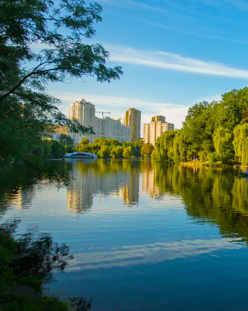 A picturesque body of water, harmoniously integrated into the urban landscape of a smart city.