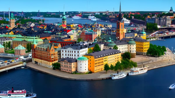 Aerial view of Stockholm's Gamla Stan waterfront featuring Riddarholmen Church and historic buildings along the Baltic Sea.