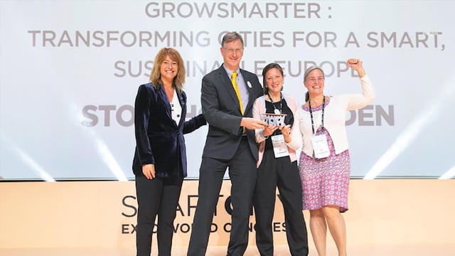 City representatives celebrating smart city Stockholm Decade-Old Apartment Complex Tech Upgrade