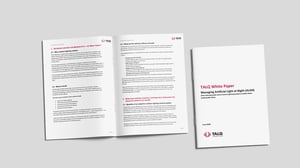 An open booklet and the front cover of a TALQ Consortium white paper on managing artificial light at night