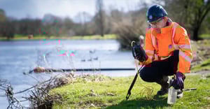 A Thames Water engineer probing water quality
