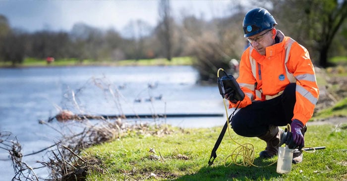 A Thames Water engineer probing water quality