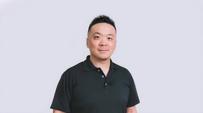 Portrait of UnaBiz CTO Alexis Susset wearing a black polo shirt against a plain white background.