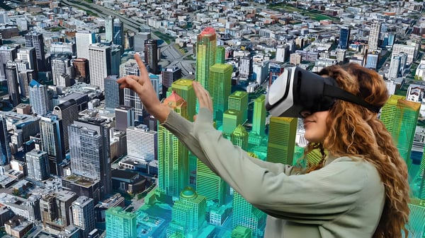 Woman wearing a VR headset interacting with a digital twin 3D city model overlaying an aerial view of a metropolitan area.