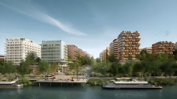 Architectural rendering of the Paris Olympic Village featuring modern apartment buildings and greenery along the Seine.