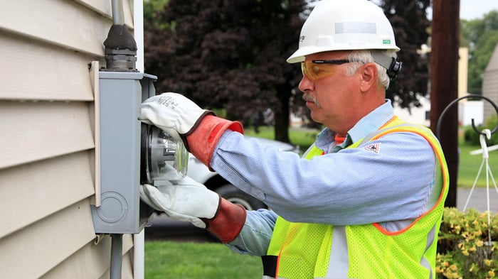 Engineer installing a smart meter