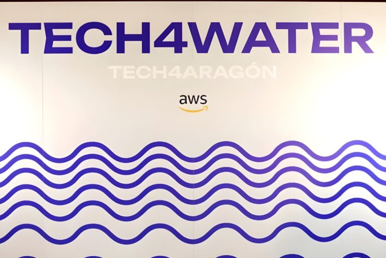 A white wall display featuring Tech4Water and Tech4Aragón text above an AWS logo and blue wave patterns.