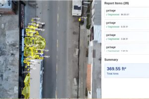 Aerbits software interface showing an aerial view of a city street with yellow AI overlays identifying illegal dumping.