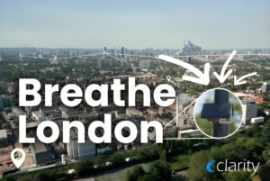 Aerial view of the London skyline with a Clarity air quality sensor mounted on a pole in the foreground.