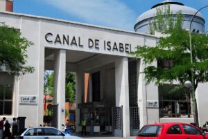 The Canal de Isabel II headquarters building entrance in Madrid with visible signage above the stone archway.