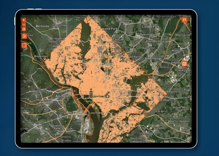 Tablet displaying a Latitudo 40 satellite map interface with orange data overlays of Washington, D.C. infrastructure.