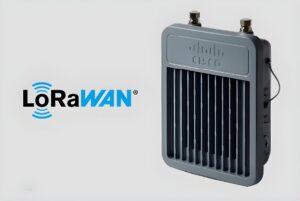 A Cisco LoRaWAN industrial gateway with a finned heat sink and antenna connectors next to a LoRaWAN logo.