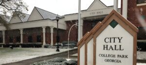 College Park Georgia City Hall building and monument sign during a light snowfall.