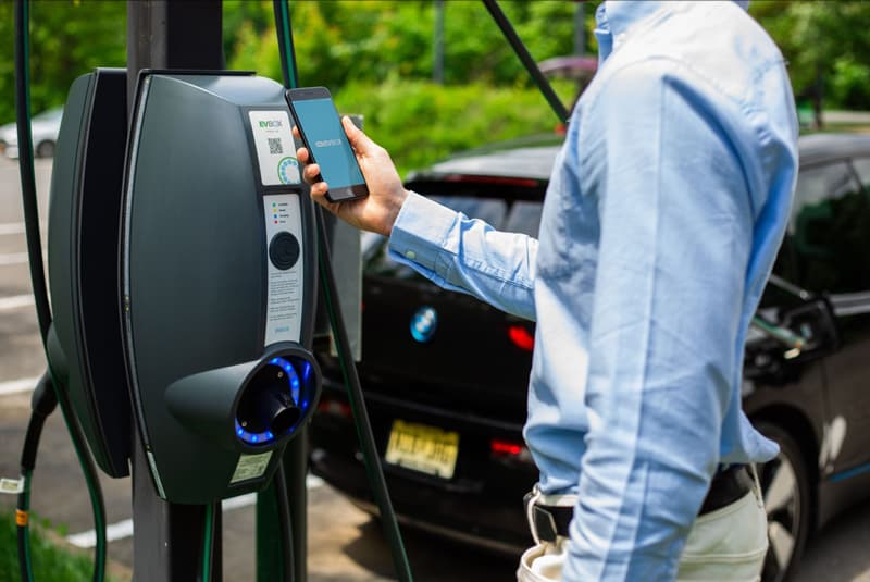 Person charging car with EVbox