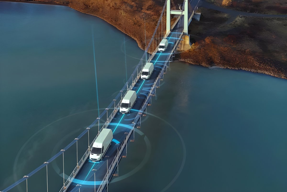 Aerial view of white vans crossing a suspension bridge with blue digital connectivity graphics and data rings.