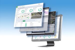 Stacked digital interface windows showing traffic management dashboards, maps, and video feeds over a computer monitor.