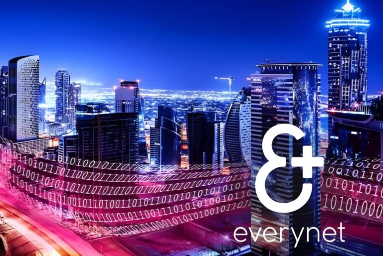 Everynet logo and binary data streams overlaid on a night skyline of illuminated skyscrapers and city infrastructure.