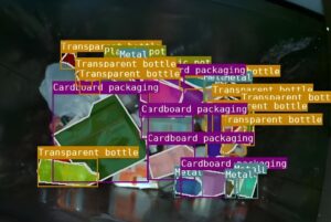 Ficha AI computer vision interface identifying recyclable waste with digital bounding boxes and category labels.