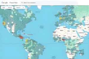 Screenshot of the Google Flood Hub interface showing a global map with hexagonal data overlays across several continents.